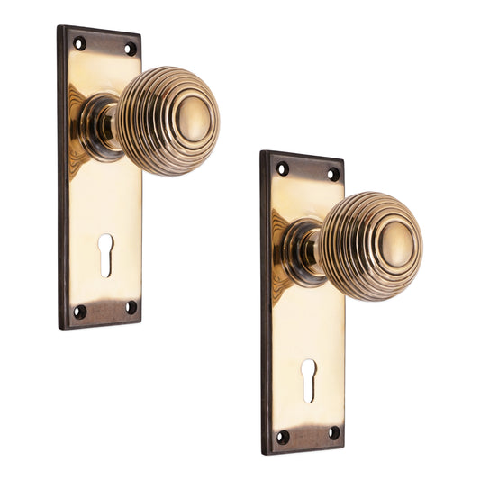 Beehive Knob on Backplate Lock Aged Brass