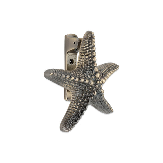 Heurtoir de porte étoile de mer en laiton antique